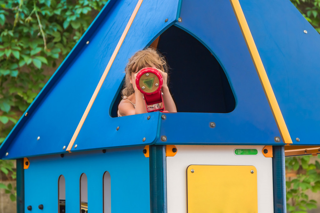 a child with telescope