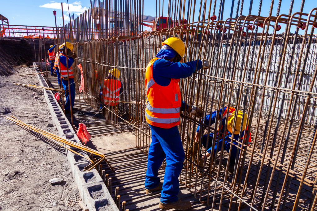 Many construction workers doing their job at a site