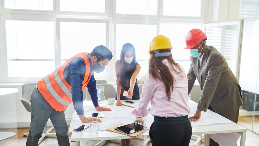 a team of construction professionals having a meeting in a table 