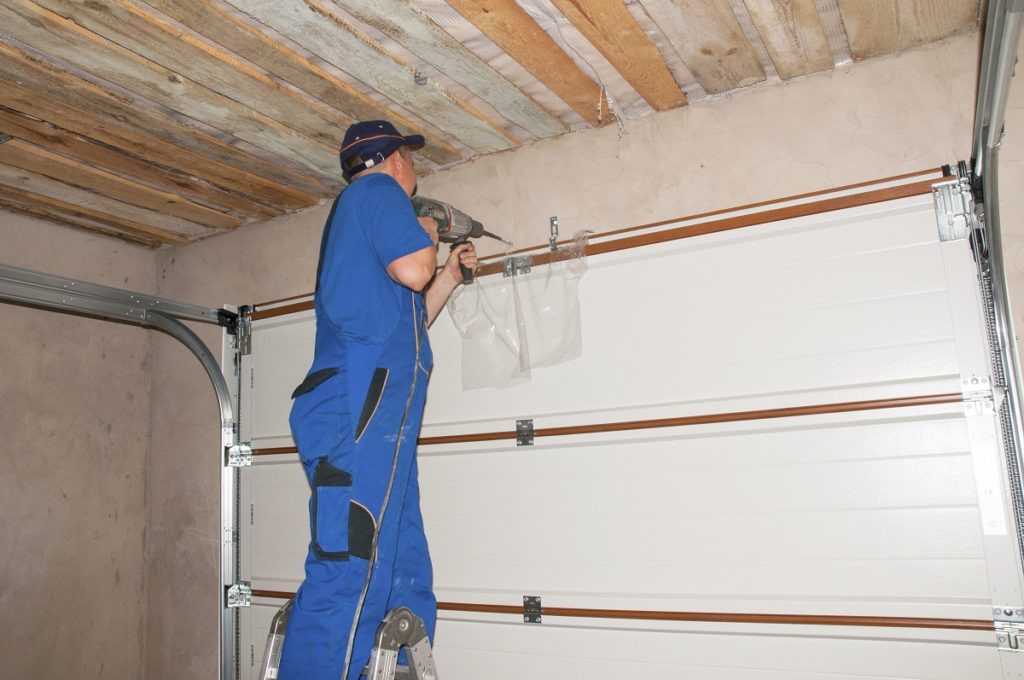 man installing insulation to the wall