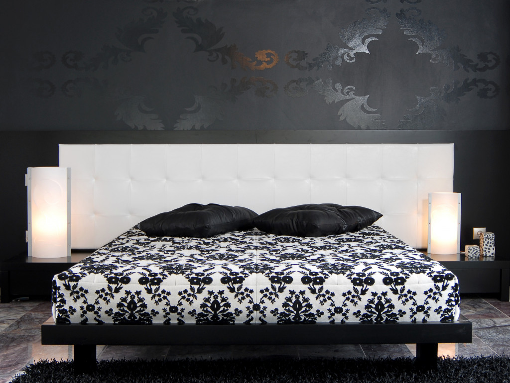 a contemporary bed with black and white accent