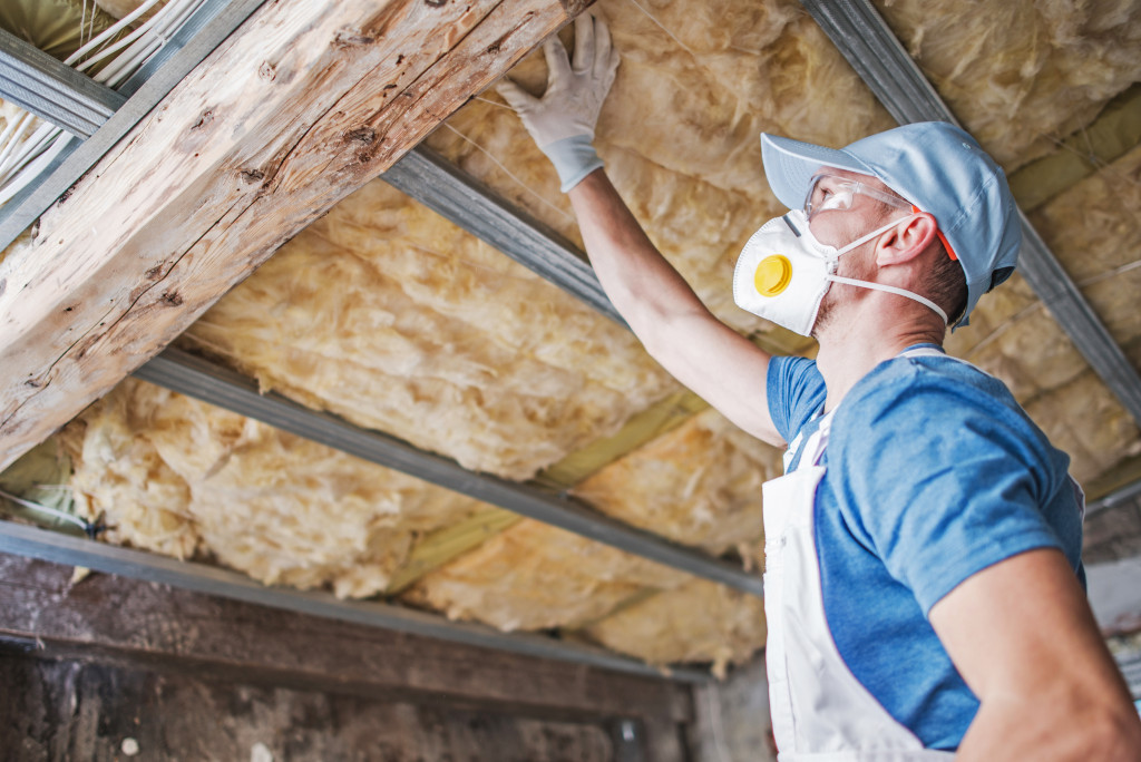 Professional contractor checking the insulation of a home.