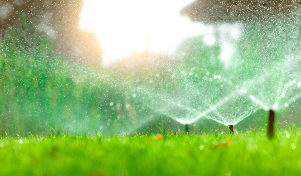 Several water sprinklers in a garden