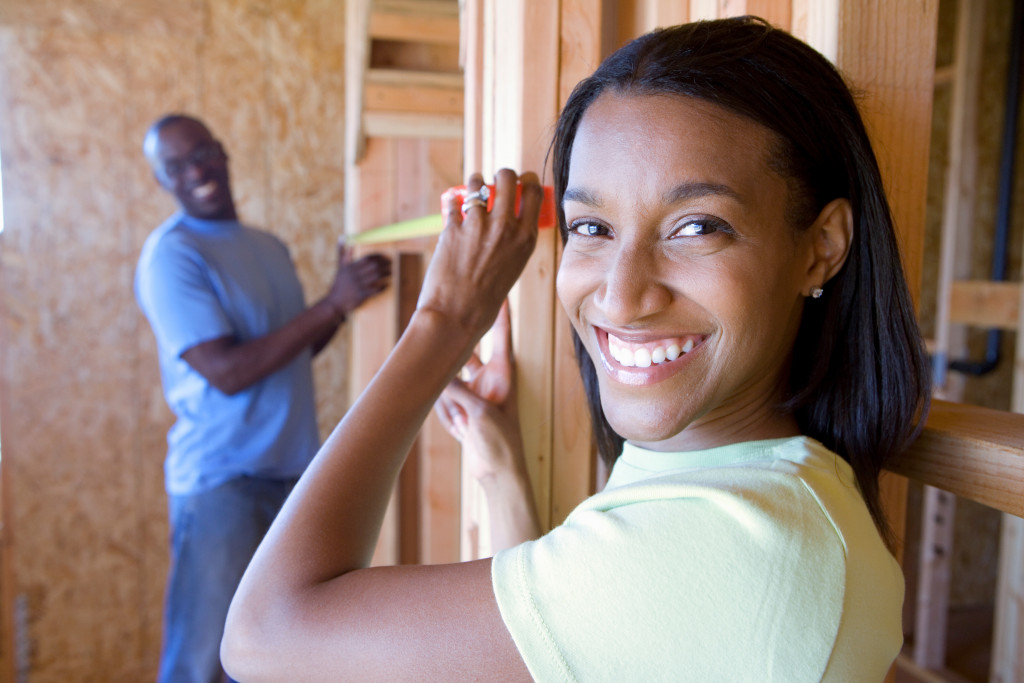 a couple helpingin the improvement of their home