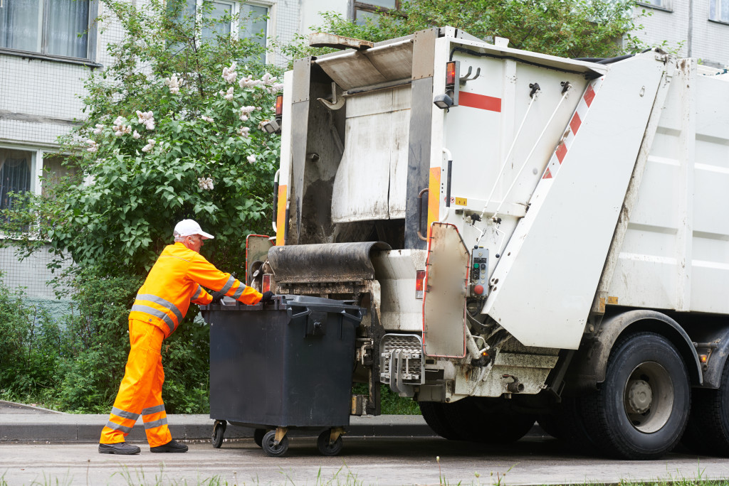 garbage truck collecting trash