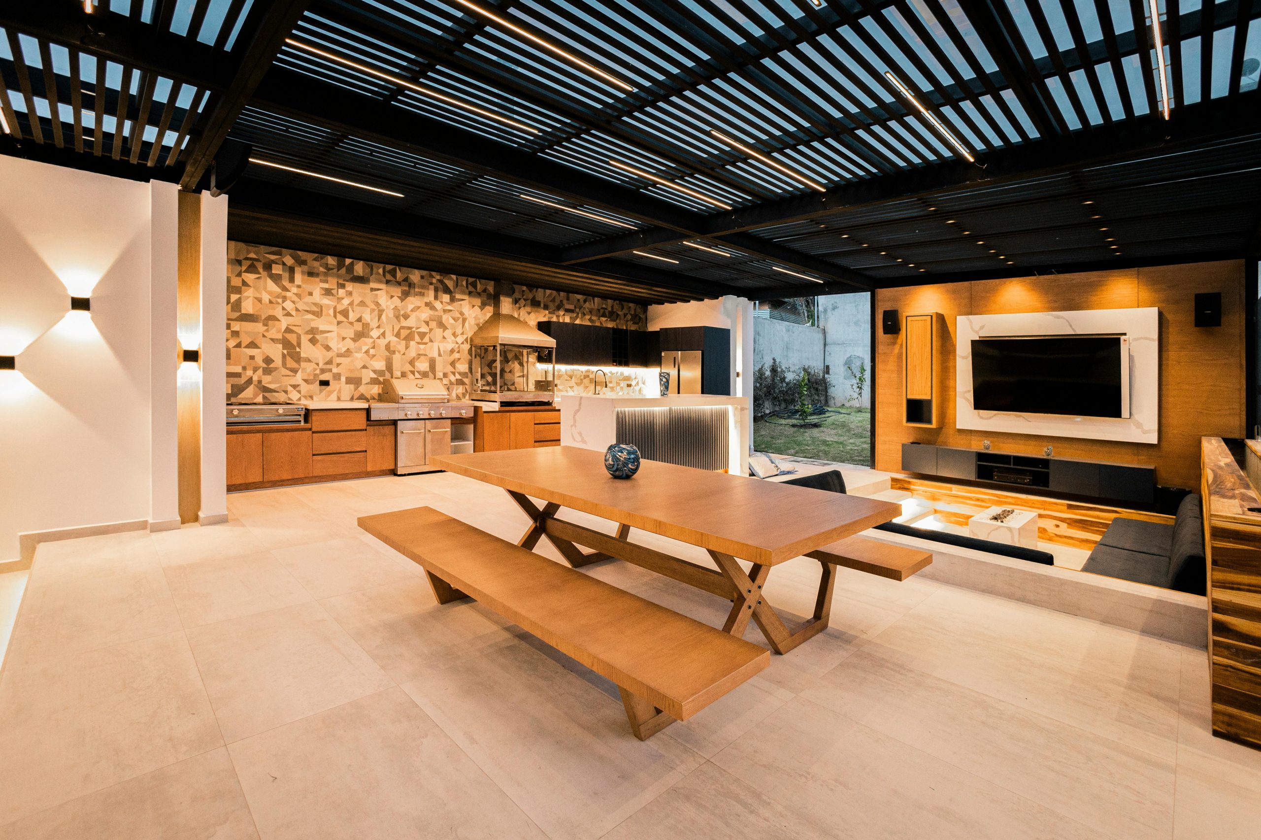 outdoor kitchen, dining, and living space